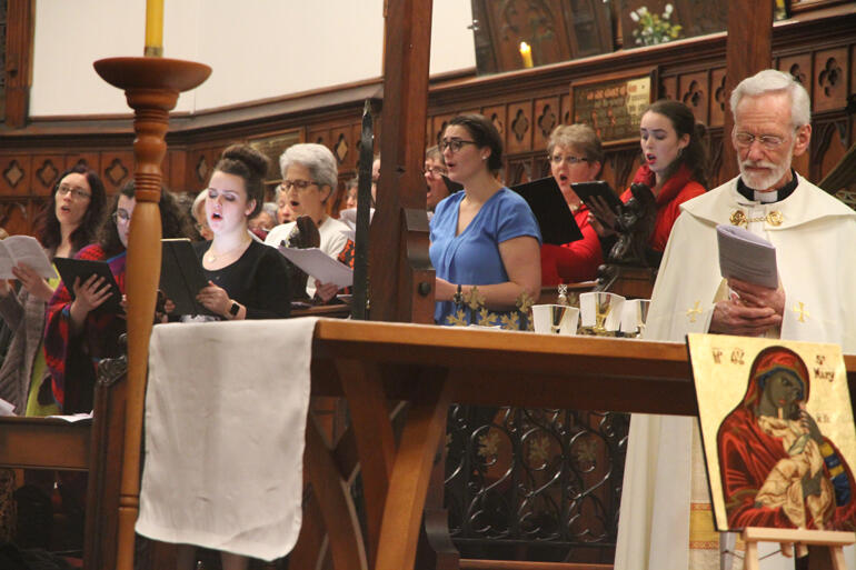The choir gives it their all during the Hui opening mass. The choir gives it their all during the Hui opening mass.