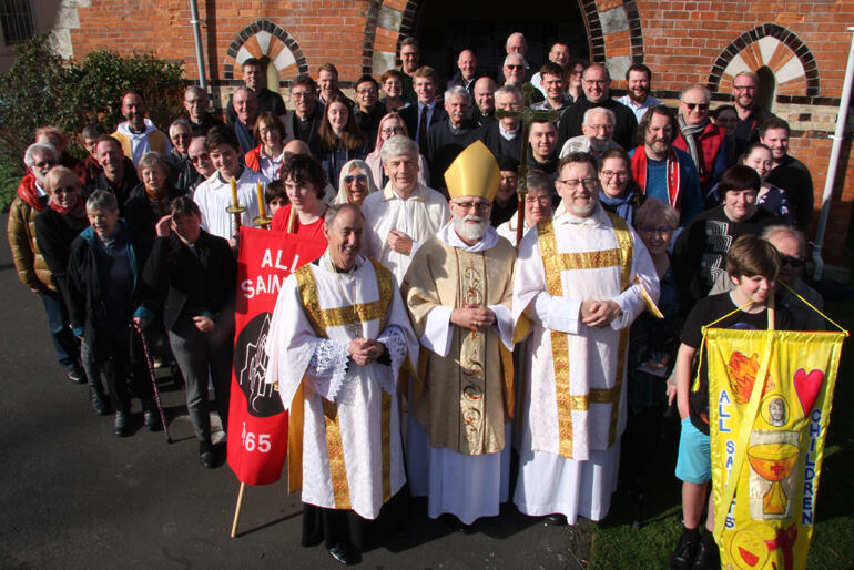 Two bishops down, remaining hui members grab a group shot after the closing mass. Two bishops down, remaining hui members grab a group shot after the closing mass.