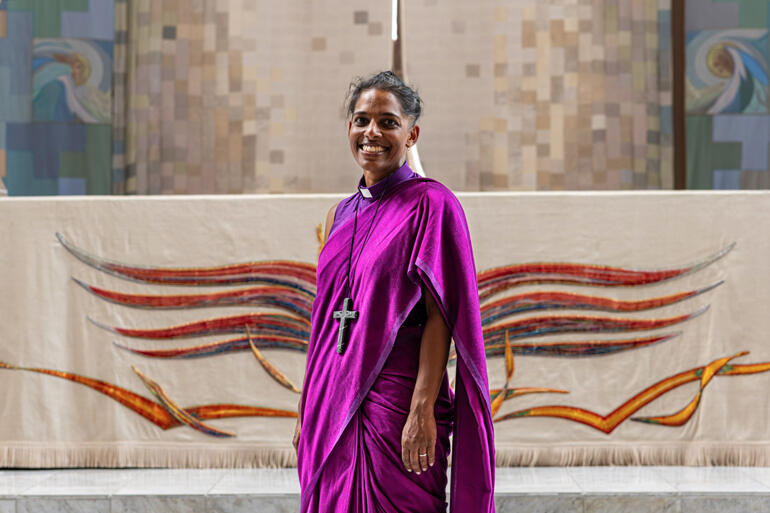 Bishop Anashuya Fletcher stands before the high altar in Wellington's Cathedral of St Paul.Image: Justin Ravenswood