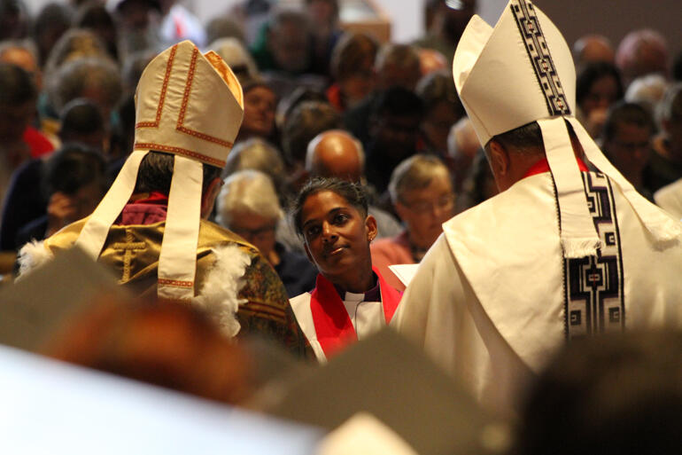 Bishop-elect Anashuya listens carefully to the promises before she assents.