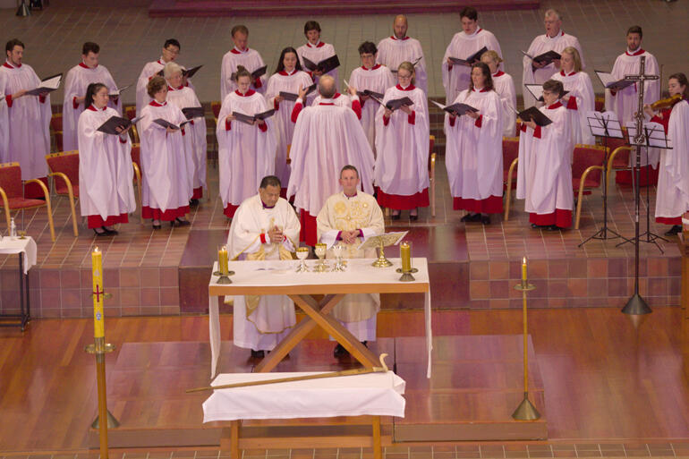 Bishop Kito and Bishop Ross preside at the Eucharist. Bishop Jim's crozier, crafted for him by his brother, sits before the altar.