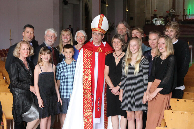 Bishop Jim White stands surrounded by whānau at his ordination as Asst. Bishop of Auckland in 2011. Photo: Lloyd Ashton