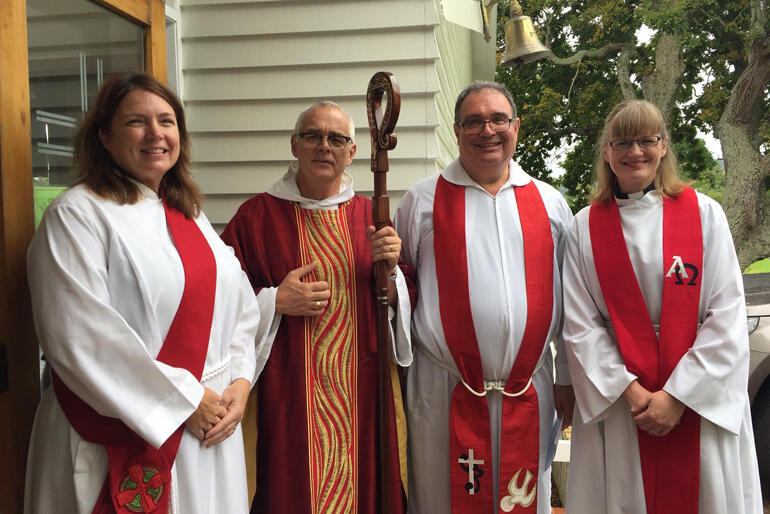 +Jim stands outside the church after Dr Jenny Blasinghame's "glorious and fun" diaconal ordination in 2017.