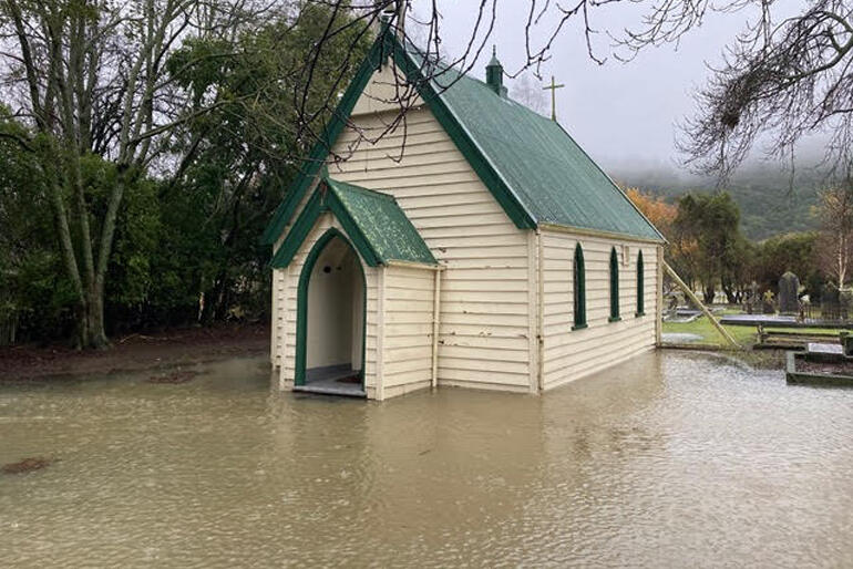 St Anne's Anglican Church in Pleasant Valley near Geraldine has a lucky escape as floodwaters recede just in time.