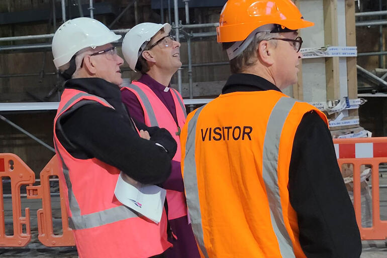 Rev Peter Beck and Bishop Peter Carrell view the Cathedral's stabilising construction with Cathedral administrator Chris Oldham.