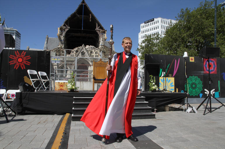 Bishop Peter Carrell faces the city and diocese in Cathedral Square following his installation in front of the ruined cathedral. 