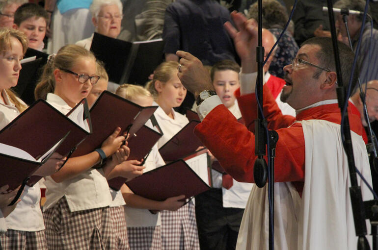 Dr John Linker directs the combined parishes and Anglican schools' choir. Dr John Linker directs the combined parishes and Anglican schools' choir.