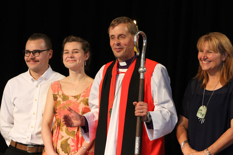 Peter turns to the people after his ordination as ninth Bishop of Christchurch L-R: Andrew, Bridget and Peter Carrell, Teresa Kundycki-Carrell. 