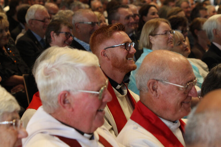 Rev Joshua Taylor enjoys a light moment. Together with Bruce Deam, Josh nominated Peter as bishop. 