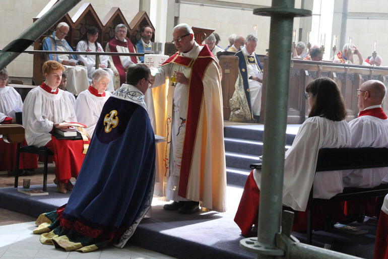 Bishop of Dunedin Rt Rev Steven Benford anoints Dean Tony Curtis.