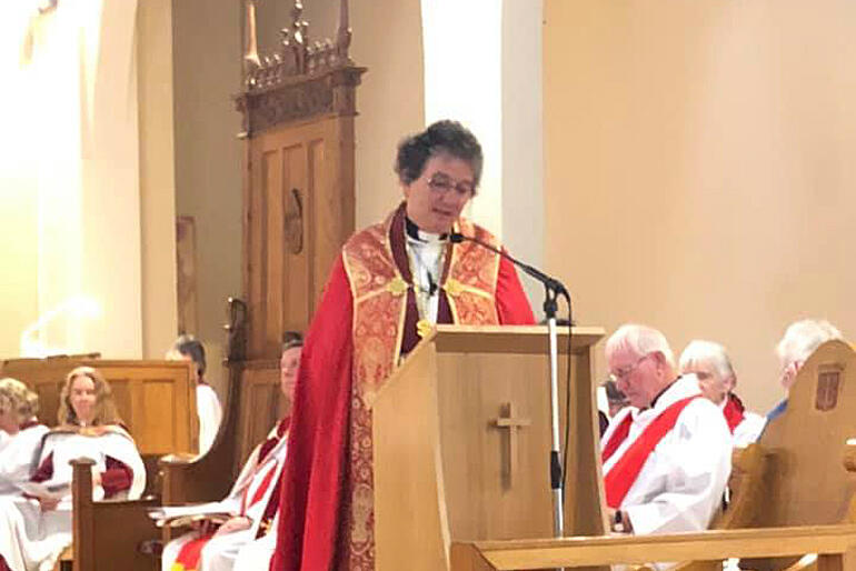 Dean Wendy Scott addresses the congregation at St Peter's from the Cathedral lectern.