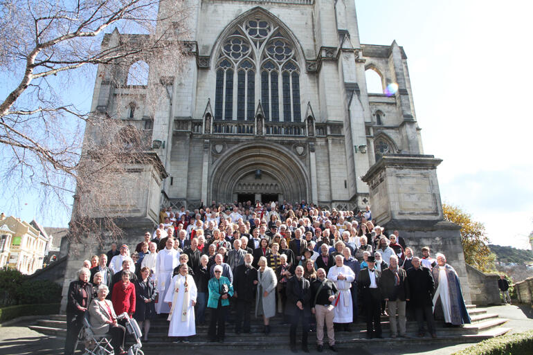 Anglicans pour out onto the steps of St Paul's Cathedral into the Spring sunshine.