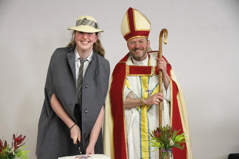 St Hilda's Collegiate School sacristan Lily Chamberlain cuts the 150th anniversary cake with Bishop Steven Benford. St Hilda's Collegiate School sacristan Lily Chamberlain cuts the 150th anniversary cake with Bishop Steven Benford.