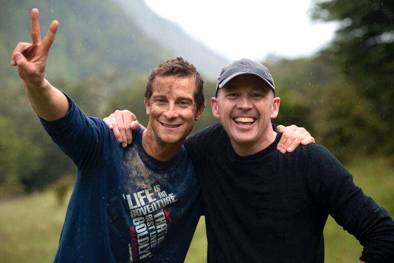 Bear Grylls and Kevin Denholm during the shooting of an Air NZ safety video. Bear Grylls and Kevin Denholm during the shooting of an Air NZ safety video.