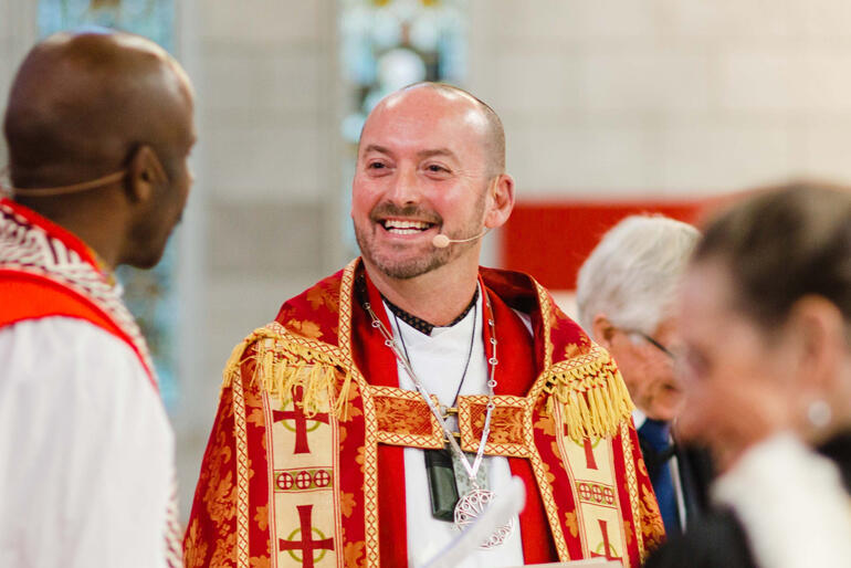 Newly installed Dean of Nelson the Very Rev Graham O'Brien smiles as he receives a warm welcome as dean from Bishop Steve Maina, July 2021. Newly installed Dean of Nelson the Very Rev Graham O'Brien smiles as he receives a warm welcome as dean from Bishop Steve Maina, July 2021.