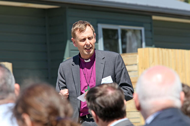 Bishop Peter Carrell addresses the people assembled to open the Guild Street Housing Community.