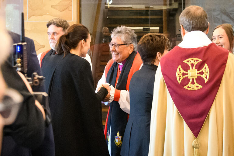 Bishop Waitohiariki Quayle greets Prime Minister Jacinda Ardern as the bishops line up to welcome people to the memorial.