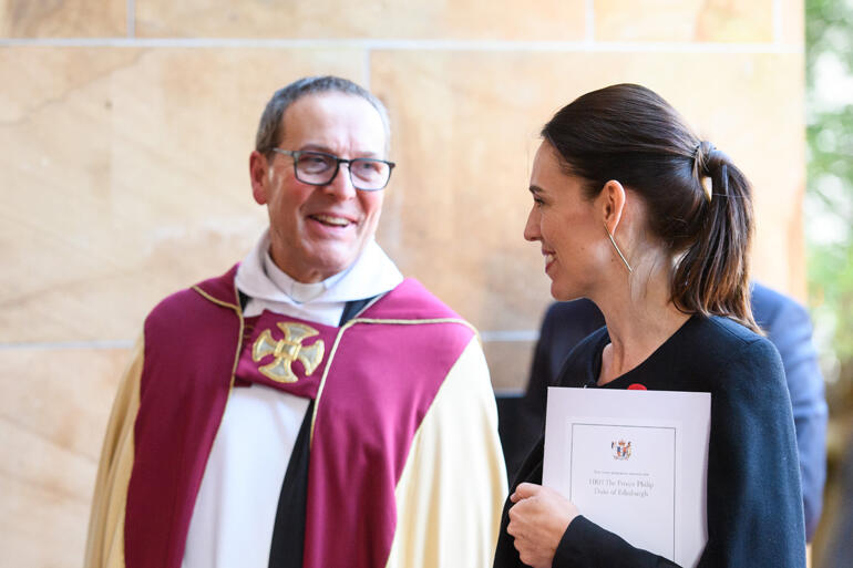 Dean of Wellington David Rowe greets Prime Minister Jacinda Ardern.