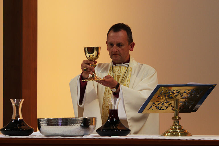 Bishop Ross Bay elevates the chalice during The Great Thanksgiving. Bishop Ross Bay elevates the chalice during The Great Thanksgiving.