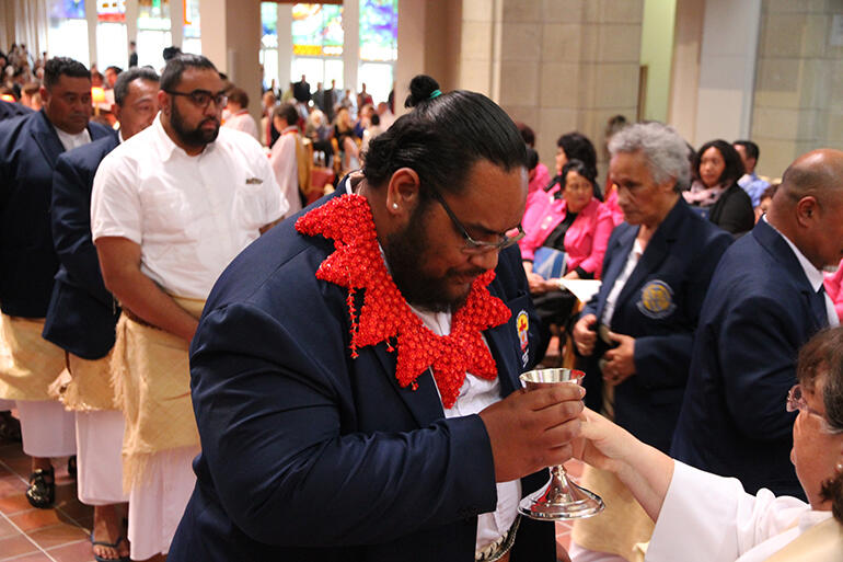 Members of the Ofa Kihe Laumalie Ma'oni'oni Church choir - the Tongan congregation choir at Holy Trinity Otahuhu - make their communion.