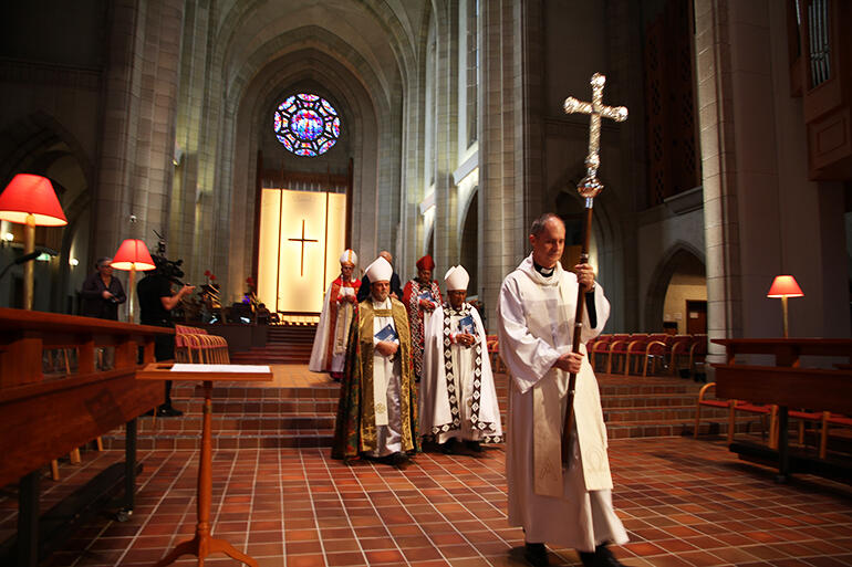 The recession: General Secretary Rev Michael Hughes leads the two Archbishops down through the chancel. The recession: General Secretary Rev Michael Hughes leads the two Archbishops down through the chancel.