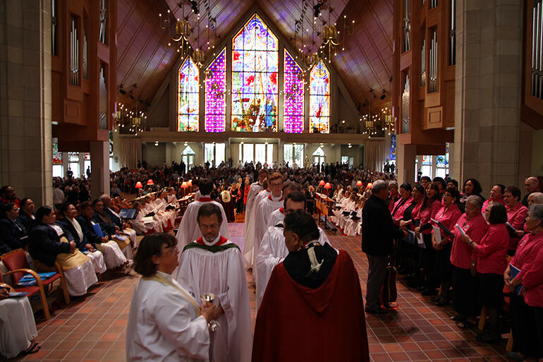 Three-part harmony - the Tongan choir at left, the Cathdral choir in white robes - and the Auckland Anglican Maori Choir at right. Three-part harmony - the Tongan choir at left, the Cathdral choir in white robes - and the Auckland Anglican Maori Choir at right.