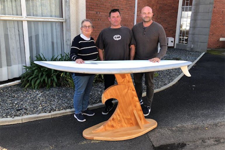 Rev Linda King, Ross Anderson & Carl Tinnion showcase the surf church altar on its way to St Nicholas Church, Ohope. Rev Linda King, Ross Anderson & Carl Tinnion showcase the surf church altar on its way to St Nicholas Church, Ohope.