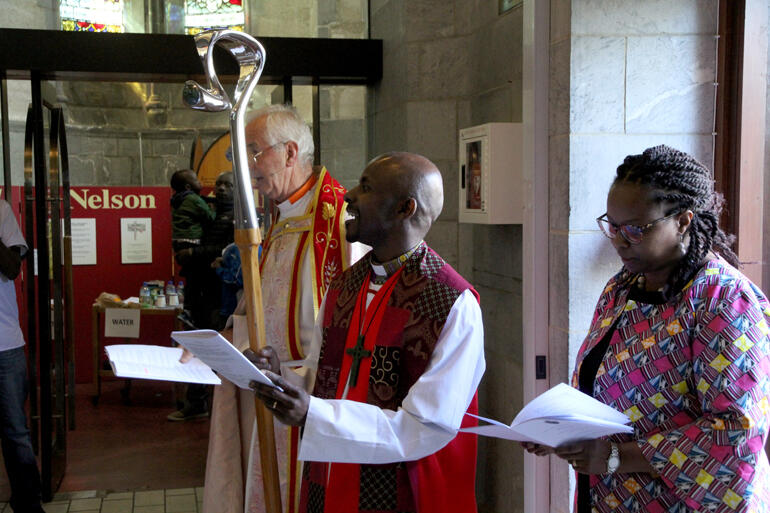 Bishop Steve Maina Mwangi enters his Cathedral as bishop, on the way to being installed Bishop of Nelson.