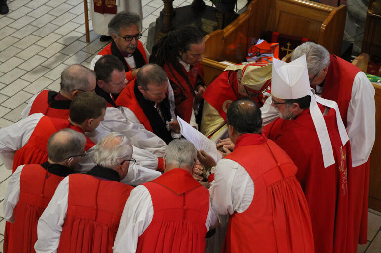 Bishops of the Anglican Church in Aotearoa, New Zealand and Polynesia lay hands on Steve Maina to ordain him bishop. Bishops of the Anglican Church in Aotearoa, New Zealand and Polynesia lay hands on Steve Maina to ordain him bishop.