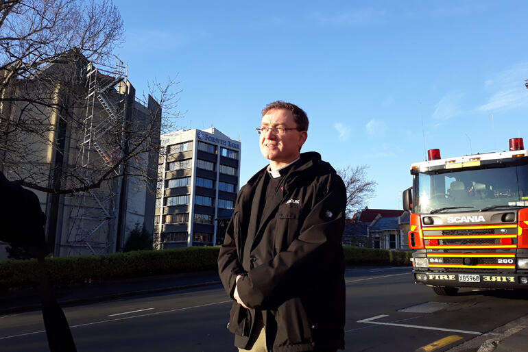 Dean of Dunedin Very Rev Tony Curtis on the scene of a fire at St Paul's Cathedral this morning already hours into his day after a 4.20am start. Dean of Dunedin Very Rev Tony Curtis on the scene of a fire at St Paul's Cathedral this morning already hours into his day after a 4.20am start.