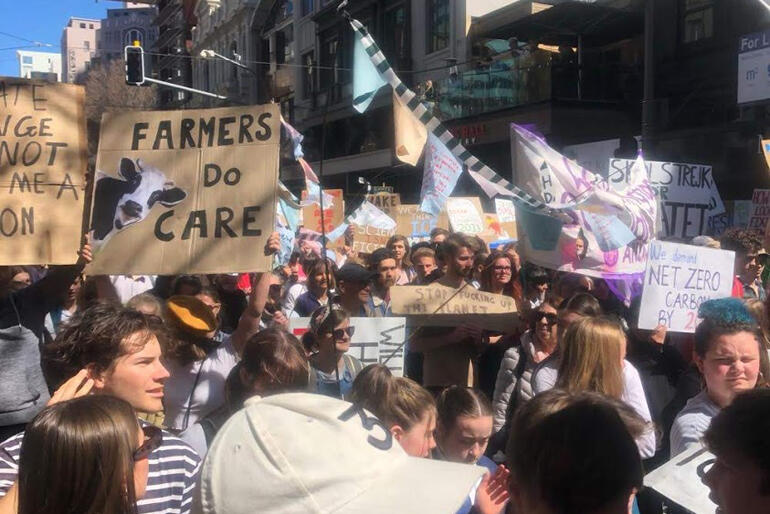 A sign at the Wellington climate march echoes the voice of a rural Anglican delegate at Wellington's recent synod.