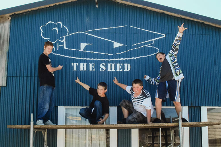 Young people outside the Greymouth Churches Community Youth Project space, 'The Shed' after painting a new frontage in 2010.