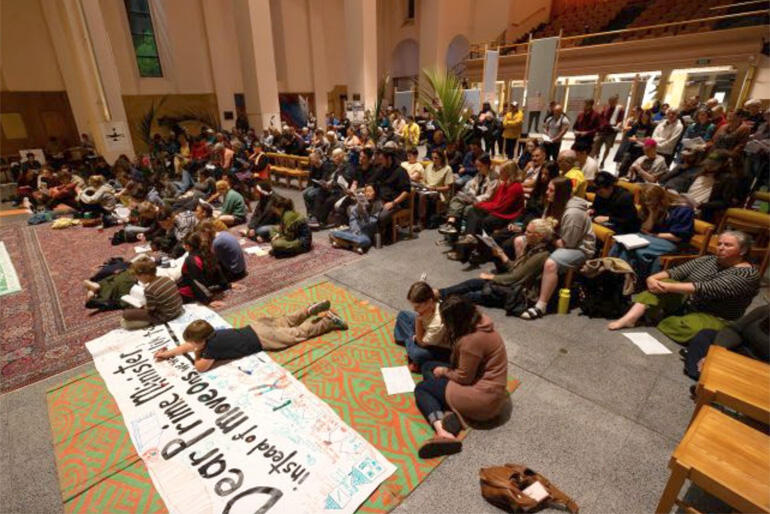Hundreds of people gather at Wellington's Cathedral of St Paul to show their solidarity with homeless whānau threatened with 'Move on' laws.