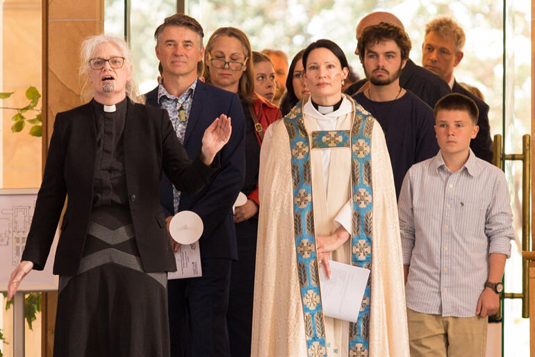 Rev Māmari Stephens calls as Very Rev Katie Lawrence and supporters enter St Paul's for her installation as Dean.