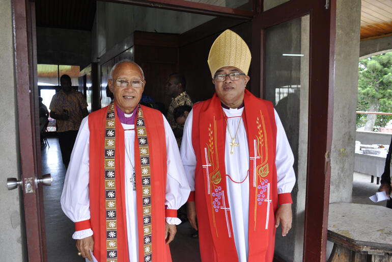 Archbishop Emeritus Winston Halapua and Archbishop Sione Uluilakepa emerge from Holy Trinity Cathedral after the ordinations.