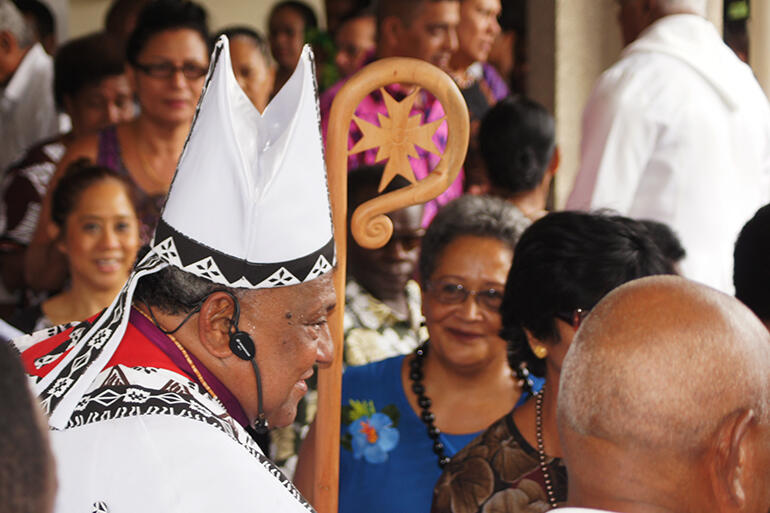 Archbishop Cama greeting wellwishers in the forecourt of the cathedral.