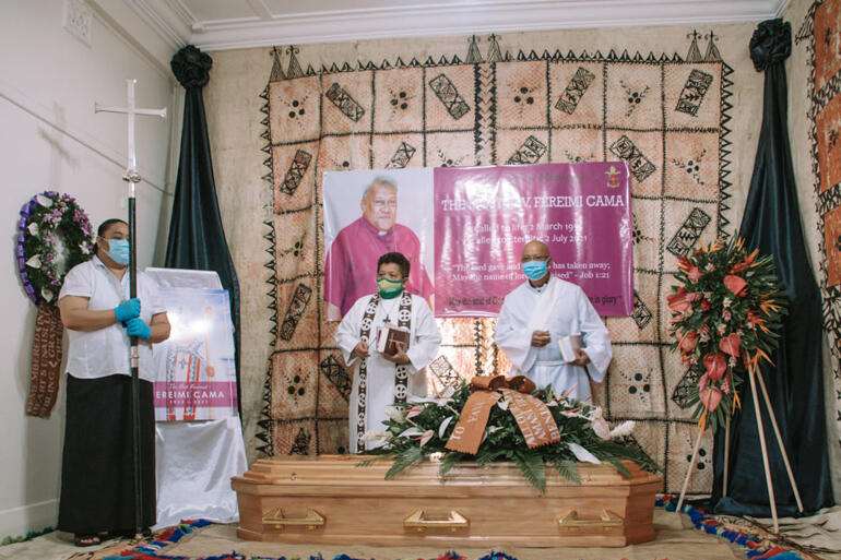 Rev Amy Chambers and Fr Daniel Houng Lee offer blessings and prayers as Archbishop Fereimi arrives at his house. 