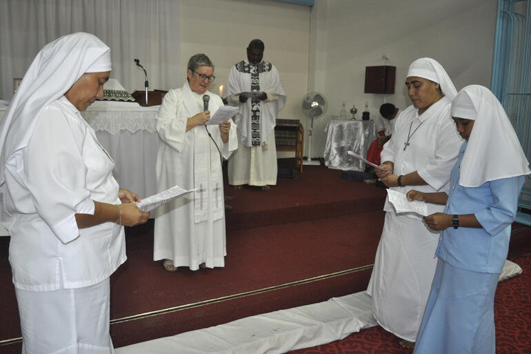 Postulant Miliva makes her vows before Moana Community of St Clare chaplain Rev Sue Halapua. Postulant Miliva makes her vows before Moana Community of St Clare chaplain Rev Sue Halapua.