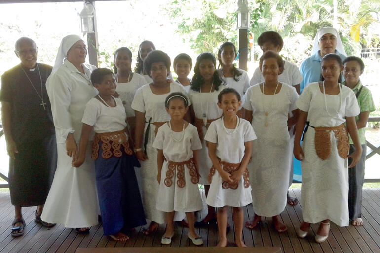 Archbishop Winston Halapua lines up with Sr Vutulongo, Sr Kalolaine and St Christopher's children in their Sunday best. Archbishop Winston Halapua lines up with Sr Vutulongo, Sr Kalolaine and St Christopher's children in their Sunday best.