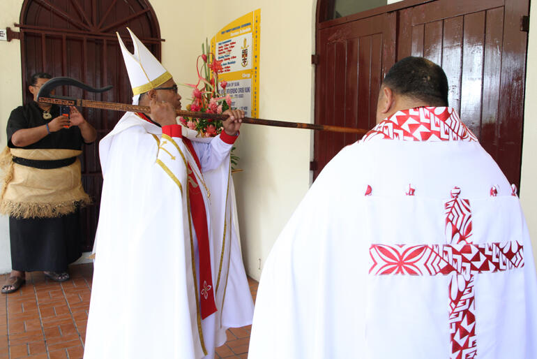 Archbishop Sione knocks on the doors at Holy Trinity, seeking entry into his Cathedral. Archbishop Sione knocks on the doors at Holy Trinity, seeking entry into his Cathedral.