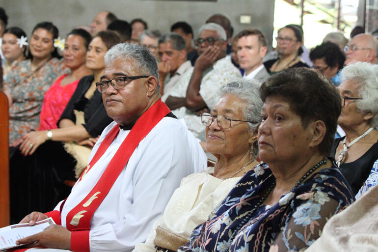 Fr Sione Uluilakepa listens while his mother Melesa Uluilakepa sits in the family pew by his side. Fr Sione Uluilakepa listens while his mother Melesa Uluilakepa sits in the family pew by his side.