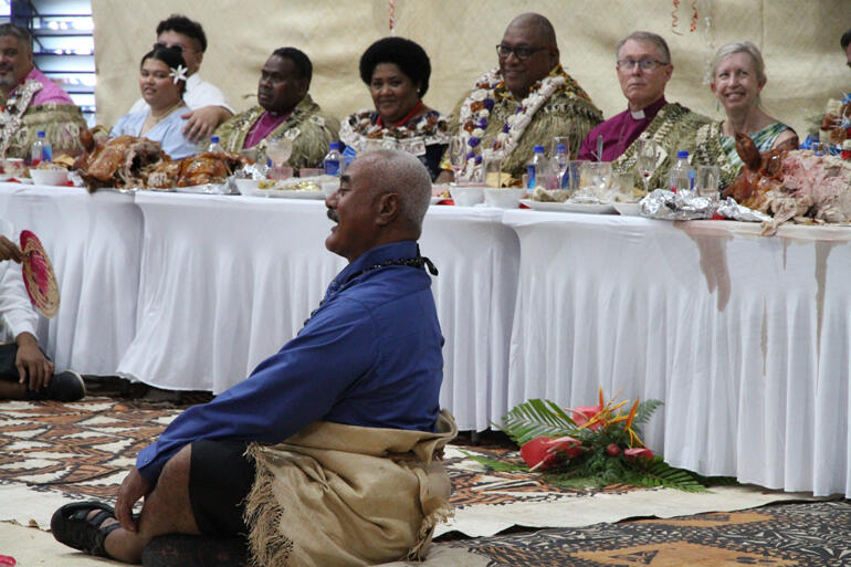 Tevita Tongia sits before the dignitaries table to lead the Tongan community as matapule. Tevita Tongia sits before the dignitaries table to lead the Tongan community as matapule.