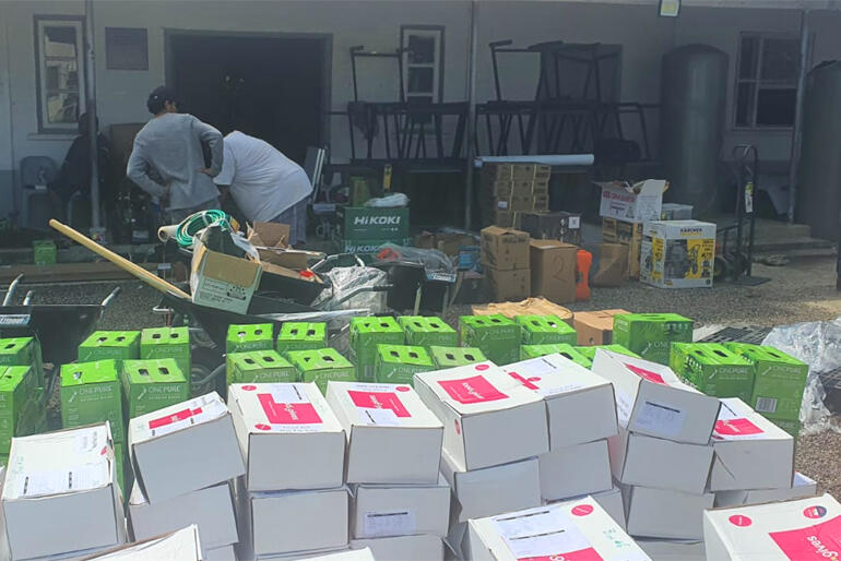 Boxes of water and emergency food, tools and gardening equipment wait for distribution after Tonga's eruption and tsunami this February Boxes of water and emergency food, tools and gardening equipment wait for distribution after Tonga's eruption and tsunami this February