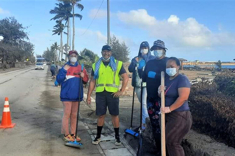 A long road ahead: members of CWS partner Tonga Community Development Trust on post-tsunami clean-up. Image: Marian Kupu/ BroadcomFM A long road ahead: members of CWS partner Tonga Community Development Trust on post-tsunami clean-up. Image: Marian Kupu/ BroadcomFM