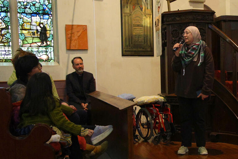 Well known Dunedin Palestinian Dr Mai Tamimi thanks Cole for the update from her home region as Archdeacon Michael Wallace looks on.