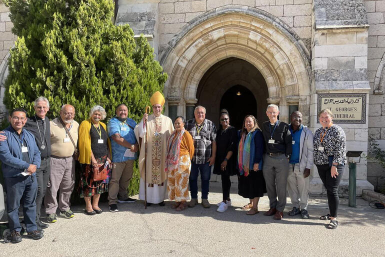 St George's pilgrims from Tamaki makaurau gather for a picture with Archbishop of Jerusalem Hosam Naoum.